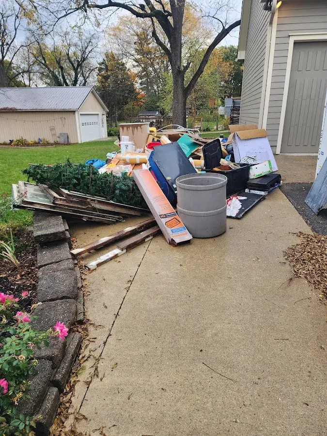 Dumpster being loaded with debris for Estate Cleanout Dumpster Rental in Willow Park